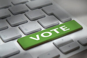white computer keyboard with "vote" button